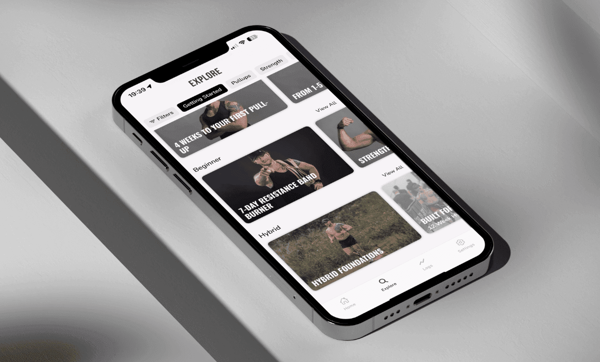 Smartphone displaying a fitness app with various workout programs and exercise categories.